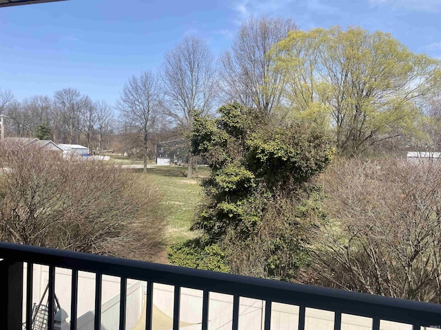 view of yard with a balcony