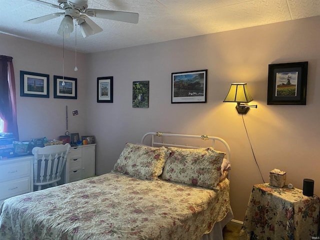 bedroom featuring a textured ceiling and ceiling fan