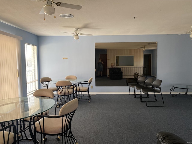 dining room featuring baseboards and ceiling fan