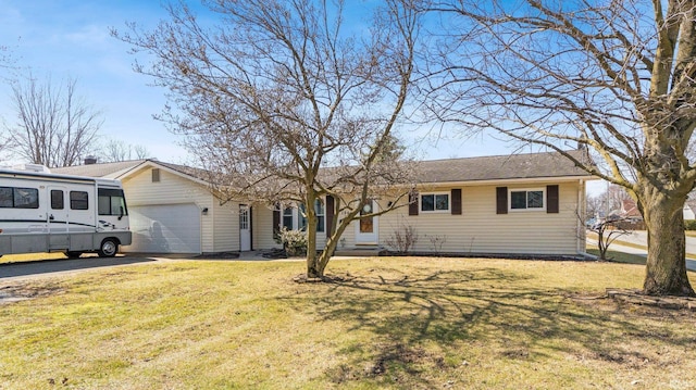 single story home with a front yard, an attached garage, and driveway