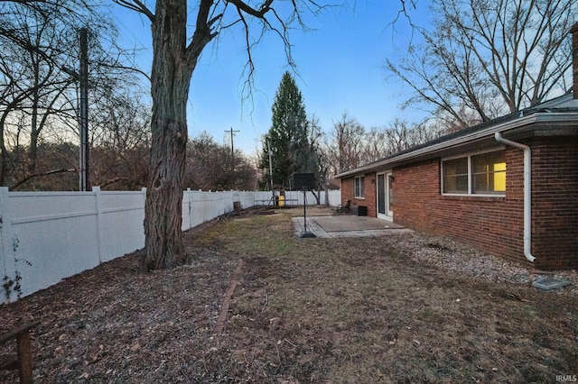 view of yard with a patio area and a fenced backyard