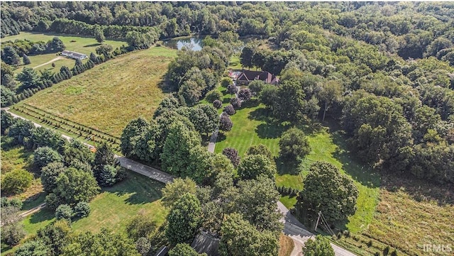 bird's eye view with a forest view and a water view