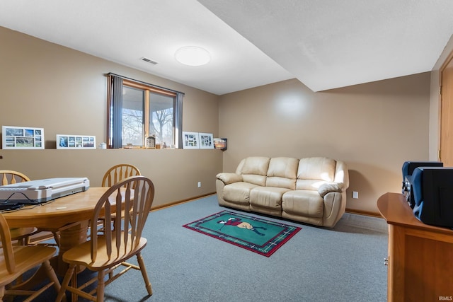 living area featuring carpet flooring, baseboards, and visible vents