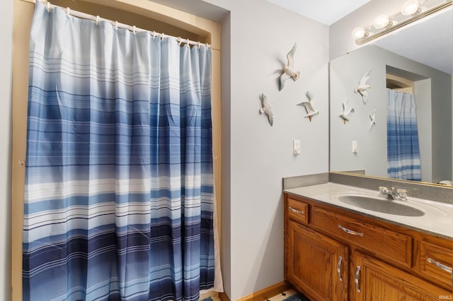 full bathroom featuring vanity and a shower with curtain