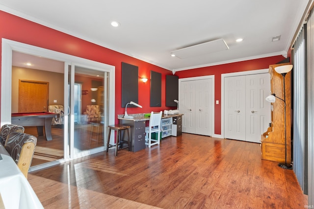 dining area with recessed lighting, wood finished floors, and ornamental molding