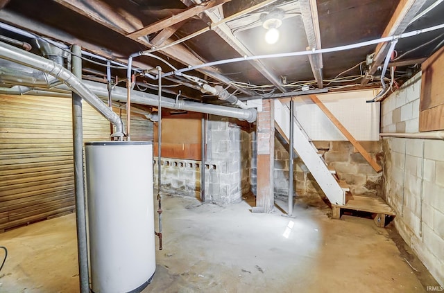 unfinished below grade area featuring water heater