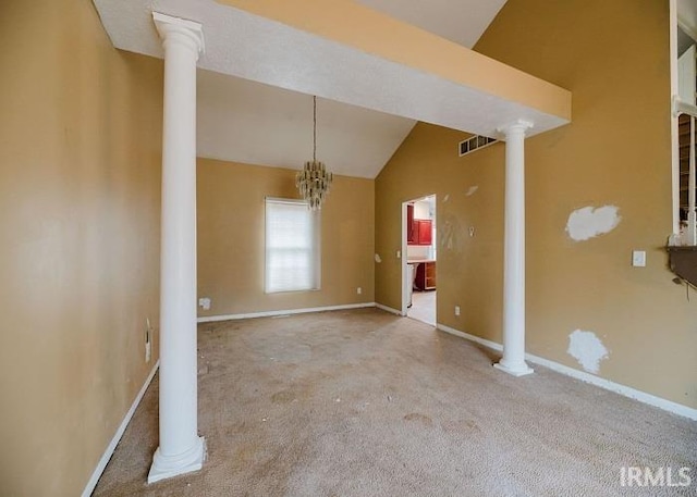 unfurnished dining area with ornate columns, baseboards, carpet flooring, and vaulted ceiling