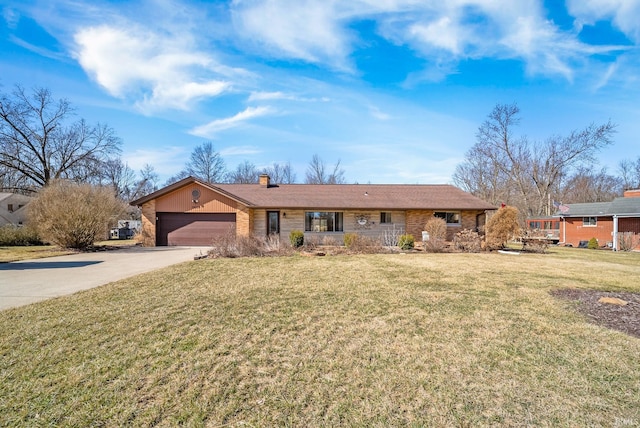 ranch-style home with a front yard, an attached garage, concrete driveway, and a chimney