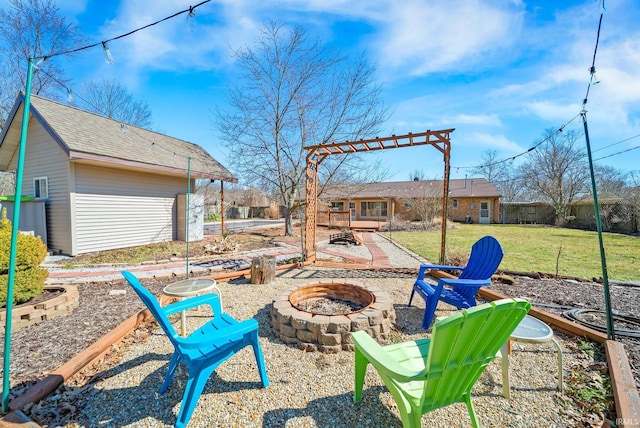 view of yard with a patio area and a fire pit