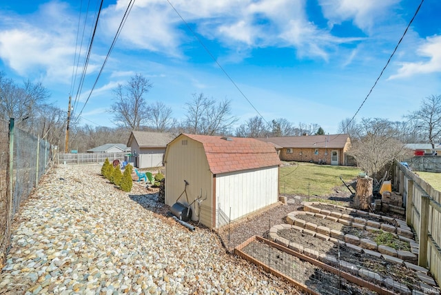 view of shed featuring a fenced backyard