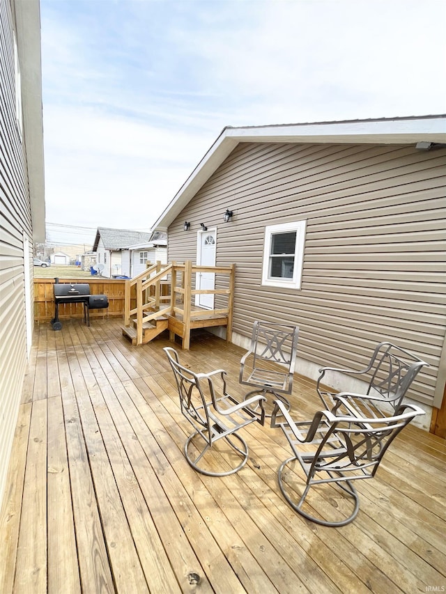 wooden terrace featuring grilling area