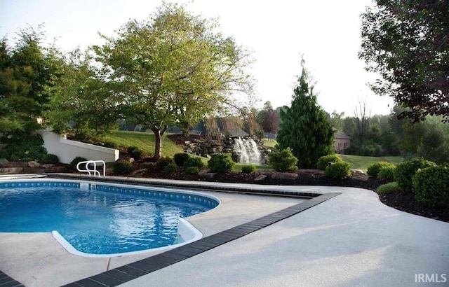 outdoor pool featuring a patio area