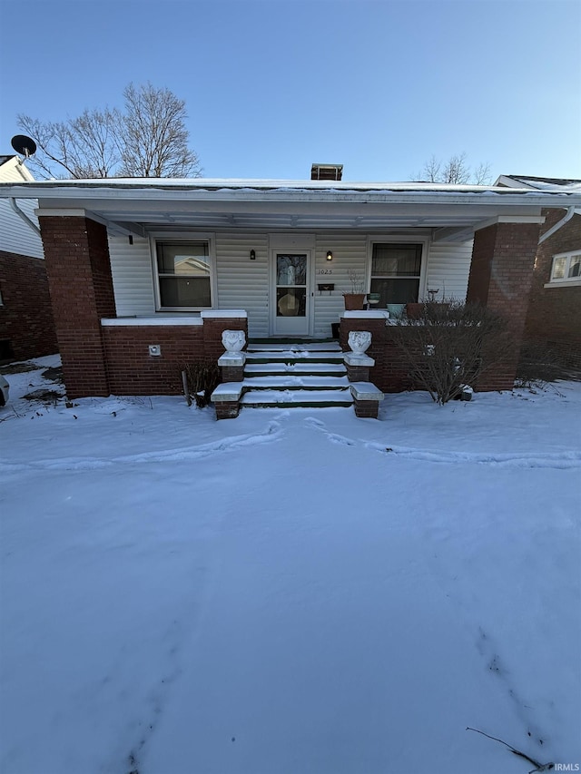 view of front of house featuring brick siding