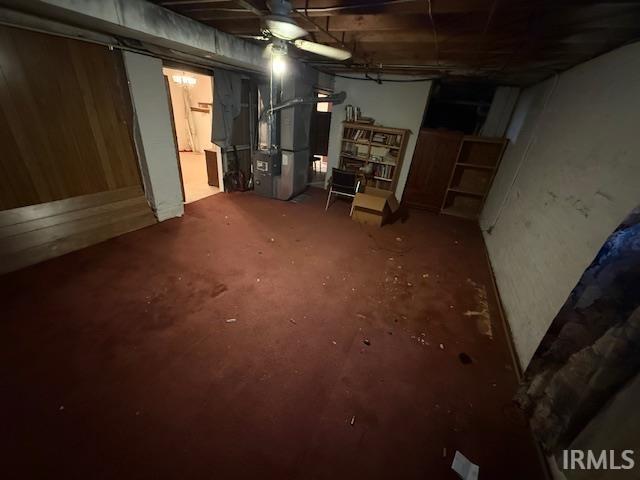 unfinished basement with heating unit