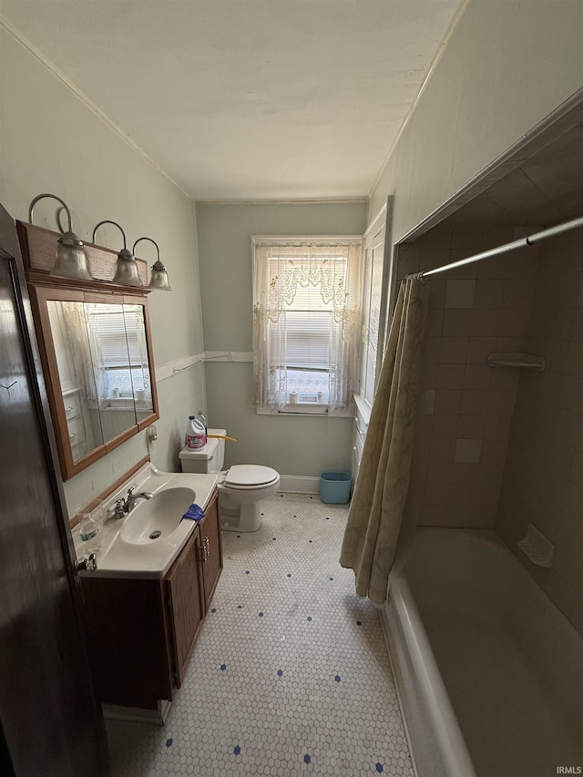 bathroom featuring vanity, tile patterned floors, toilet, and shower / tub combo with curtain