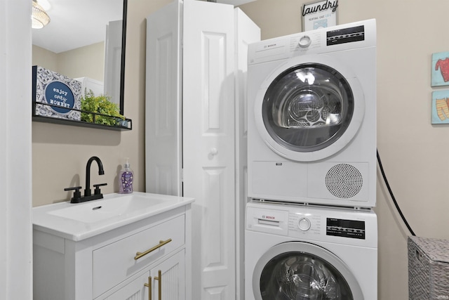 laundry room featuring laundry area, stacked washer / dryer, and a sink