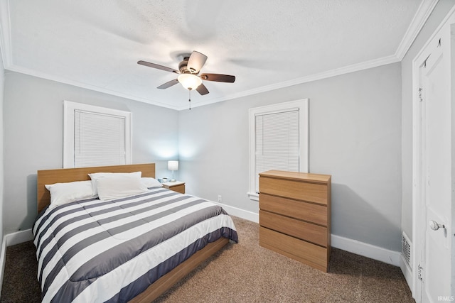 carpeted bedroom with a ceiling fan, baseboards, a textured ceiling, and crown molding