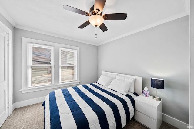 bedroom with baseboards, carpet floors, ceiling fan, and crown molding