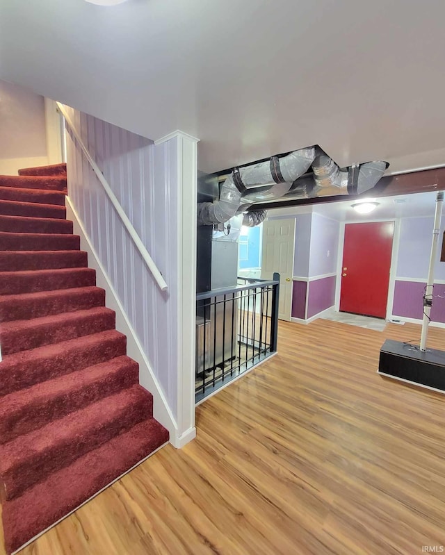 stairs with wood finished floors