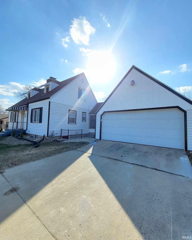 view of front of property with a detached garage