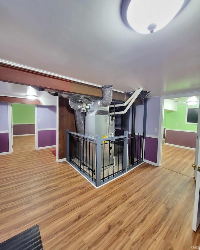 interior space featuring wood finished floors and baseboards