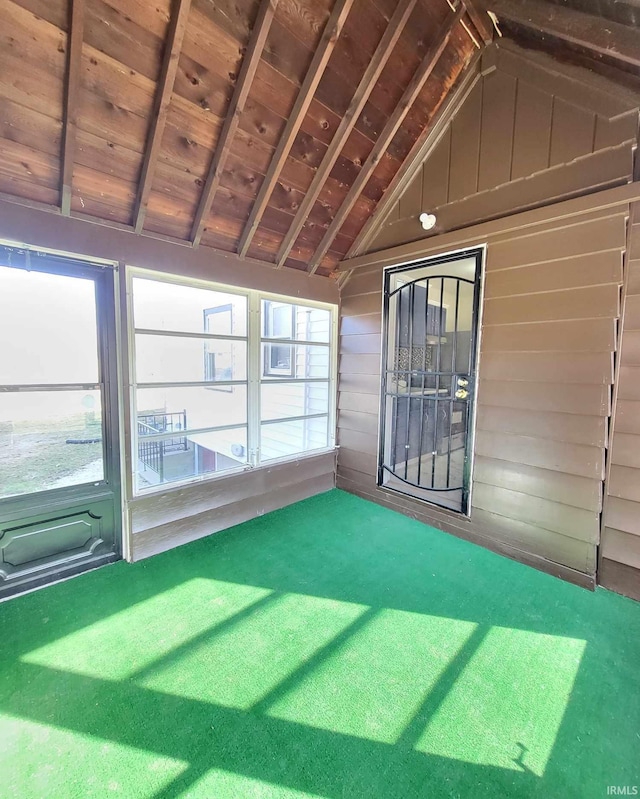 unfurnished sunroom with lofted ceiling and wooden ceiling