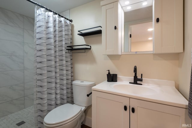 bathroom with vanity, toilet, recessed lighting, and a tile shower