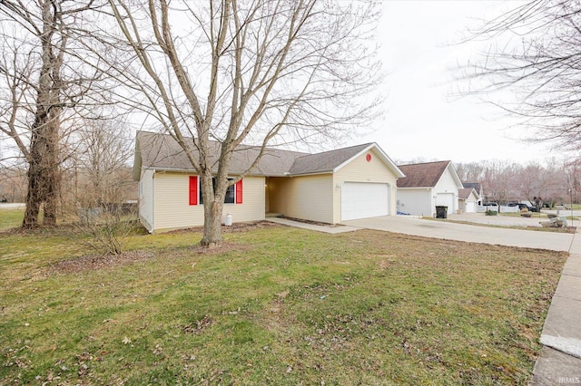 view of front of house featuring a garage, a front yard, and driveway