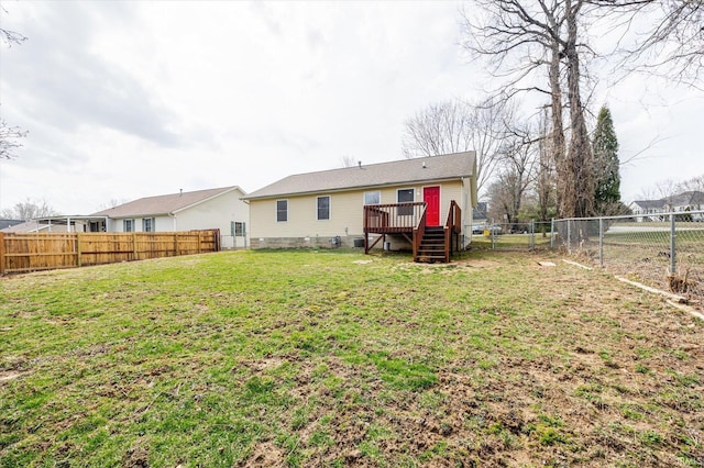 back of house with a wooden deck, a yard, a fenced backyard, crawl space, and a gate