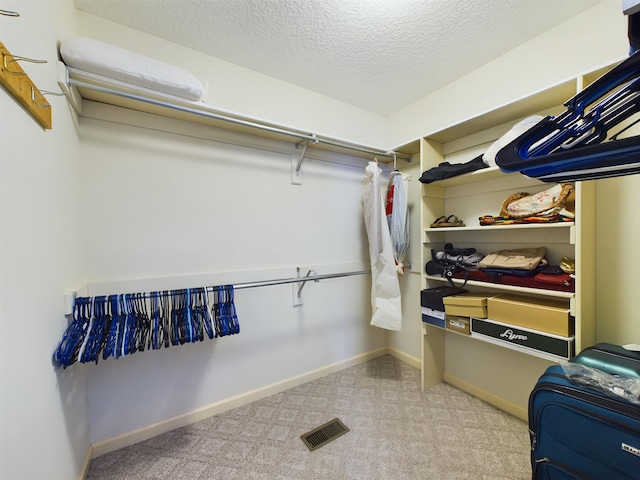 spacious closet featuring visible vents