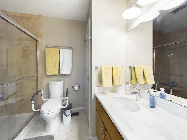 full bathroom with vanity, baseboards, tile patterned flooring, a shower stall, and toilet