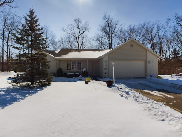 single story home with a garage, a porch, and driveway