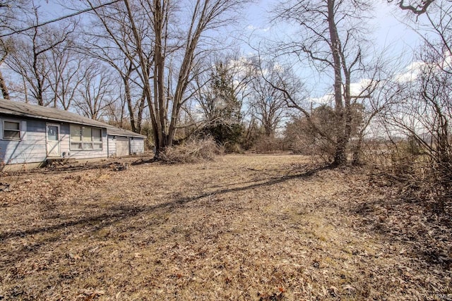 view of yard with a garage