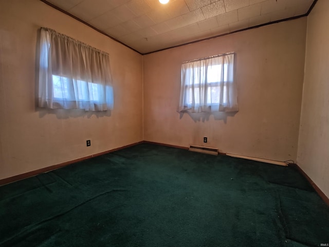 empty room featuring crown molding, baseboards, dark colored carpet, and baseboard heating