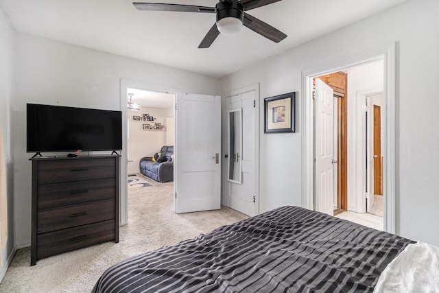 bedroom with light colored carpet and ceiling fan