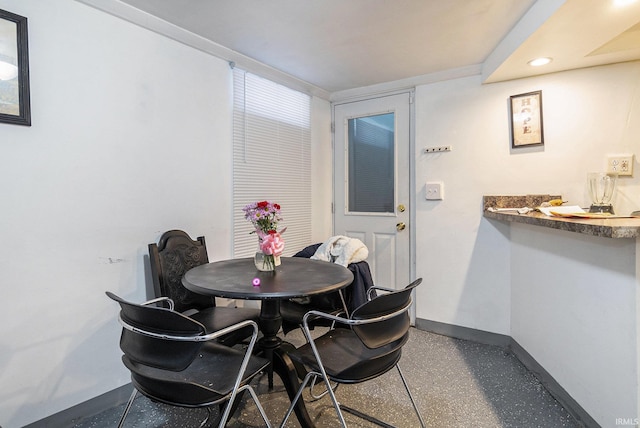 dining space featuring recessed lighting and baseboards