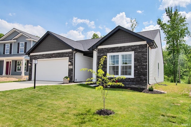 view of front of house featuring a front lawn, a garage, stone siding, and driveway