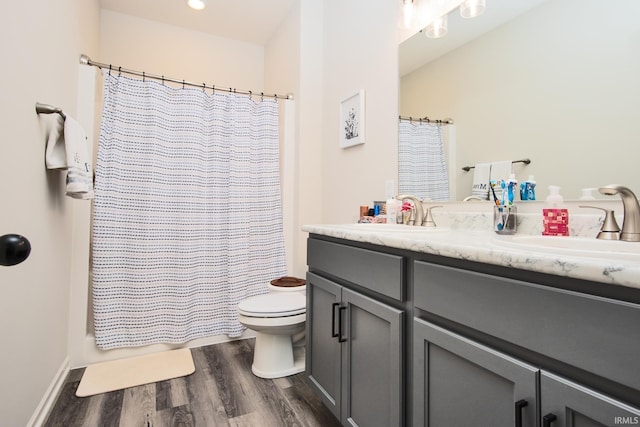 full bath with toilet, recessed lighting, wood finished floors, vanity, and shower / bathtub combination with curtain