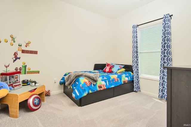 carpeted bedroom featuring baseboards