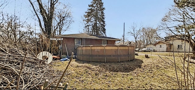 view of yard featuring a pool and fence