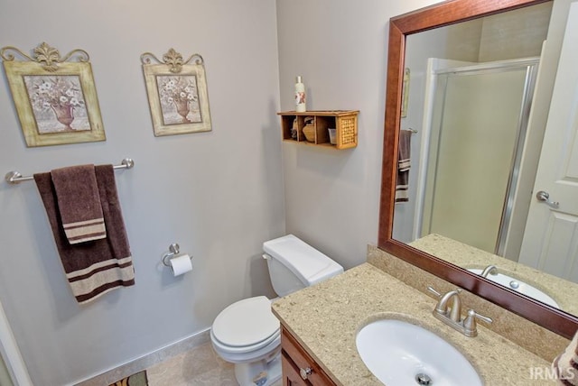 full bathroom with baseboards, vanity, toilet, and a shower stall