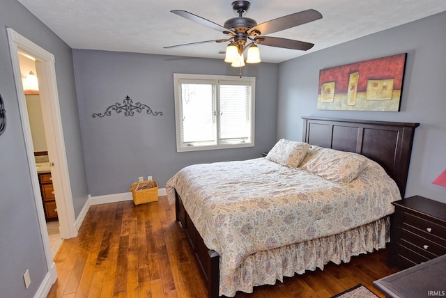 bedroom featuring baseboards, wood-type flooring, and ceiling fan