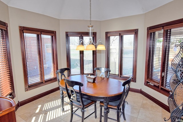 dining room with light tile patterned floors and baseboards