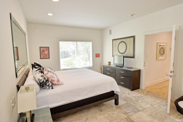 bedroom with recessed lighting and baseboards