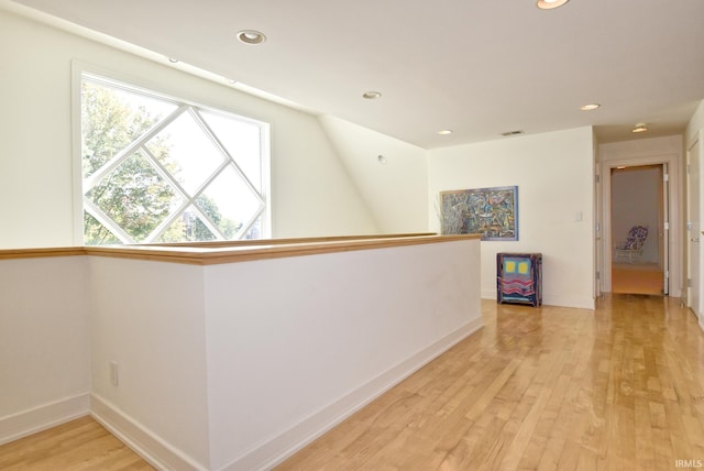 hallway featuring visible vents, recessed lighting, and light wood-type flooring