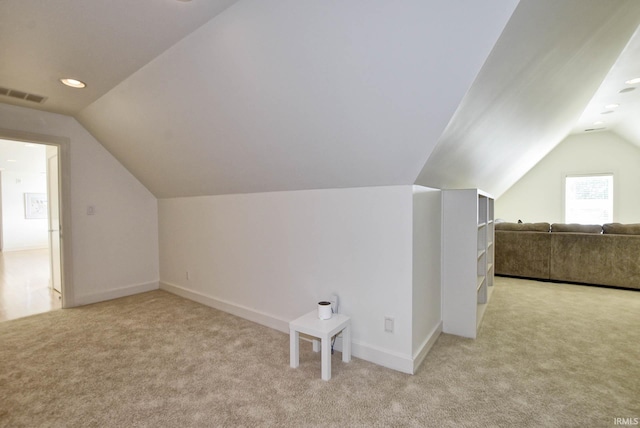 bonus room featuring visible vents, baseboards, carpet flooring, and vaulted ceiling