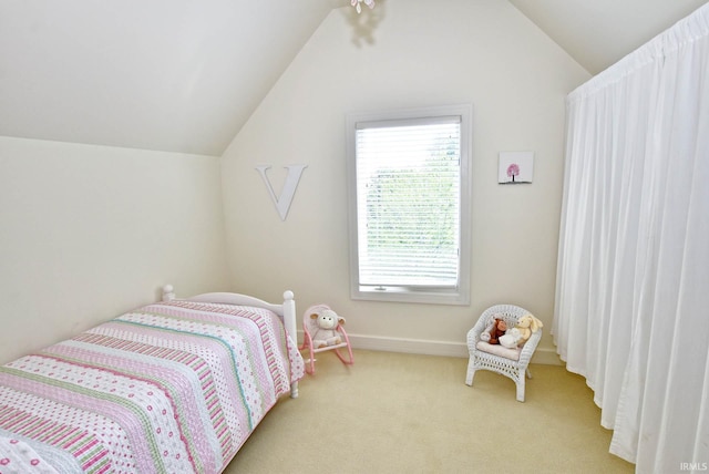 carpeted bedroom featuring vaulted ceiling