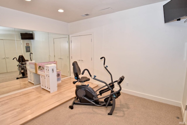 workout room featuring carpet, recessed lighting, baseboards, and visible vents