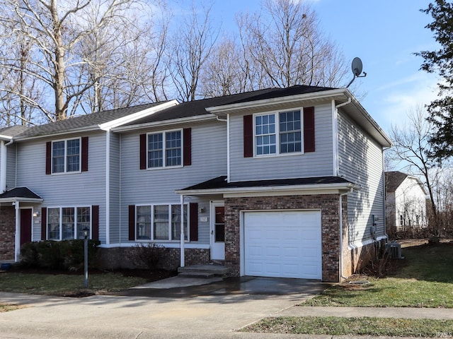 view of front of property with a garage, brick siding, and driveway