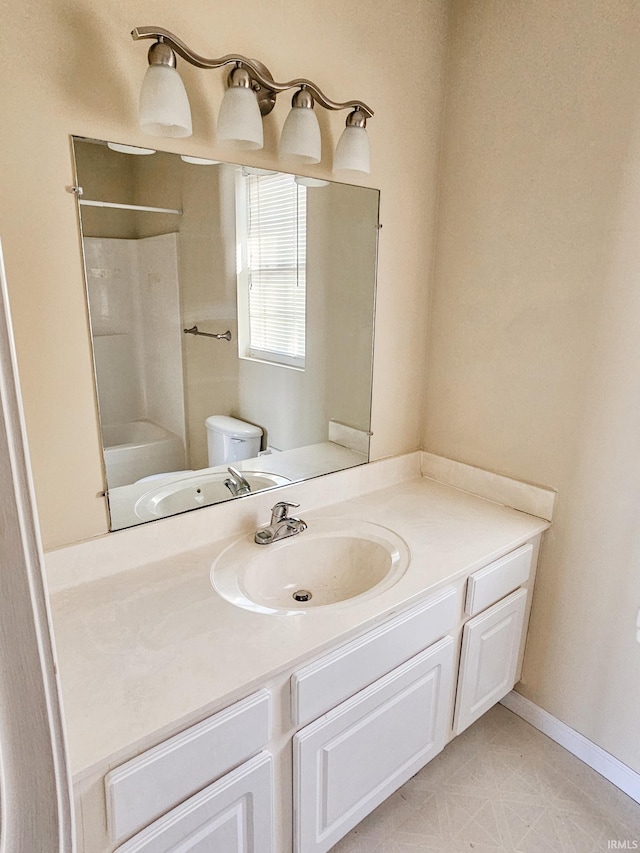 full bath featuring baseboards, toilet, tile patterned floors, vanity, and  shower combination